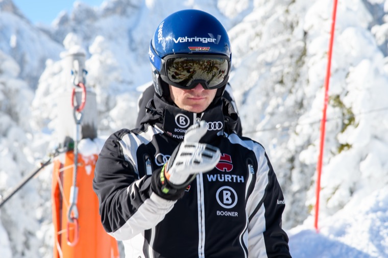 Portrait in team gear between snow-covered trees