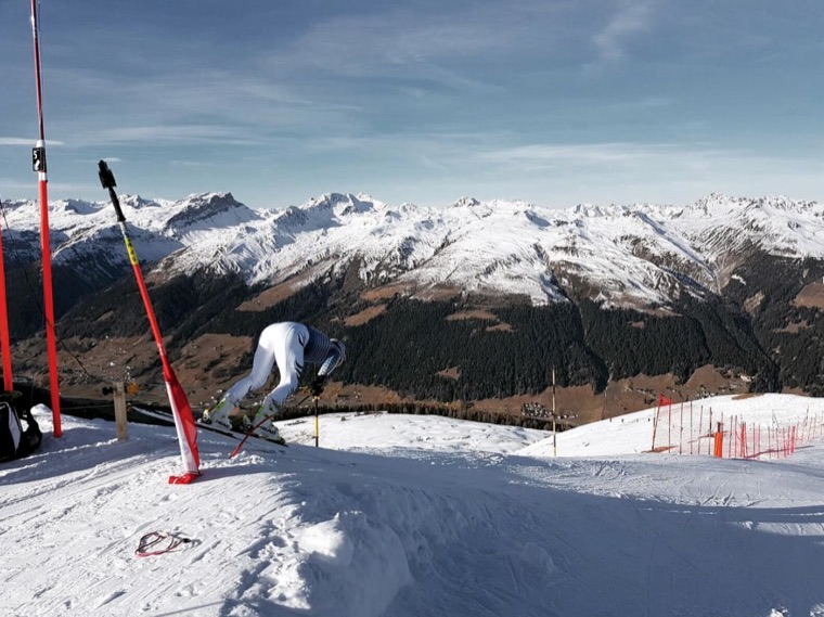 Downhill run with the Alps in the background