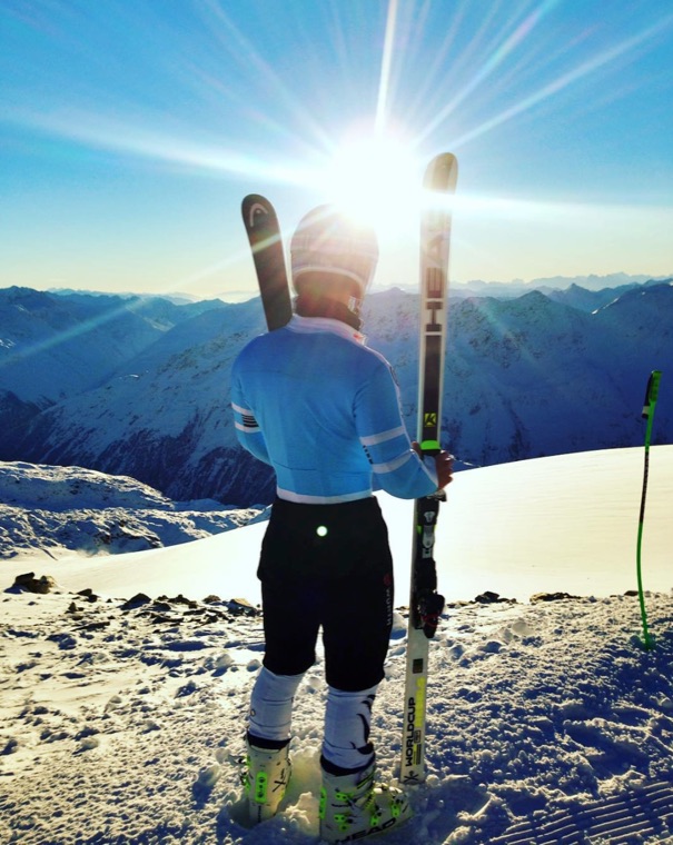Skis on the shoulder in the sunshine
